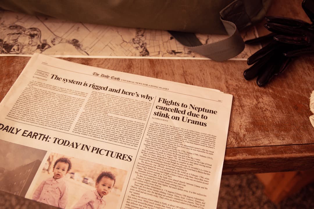 Behind the scenes photo 52 from Clone Cops production showing practical newspaper prop created for clone cops